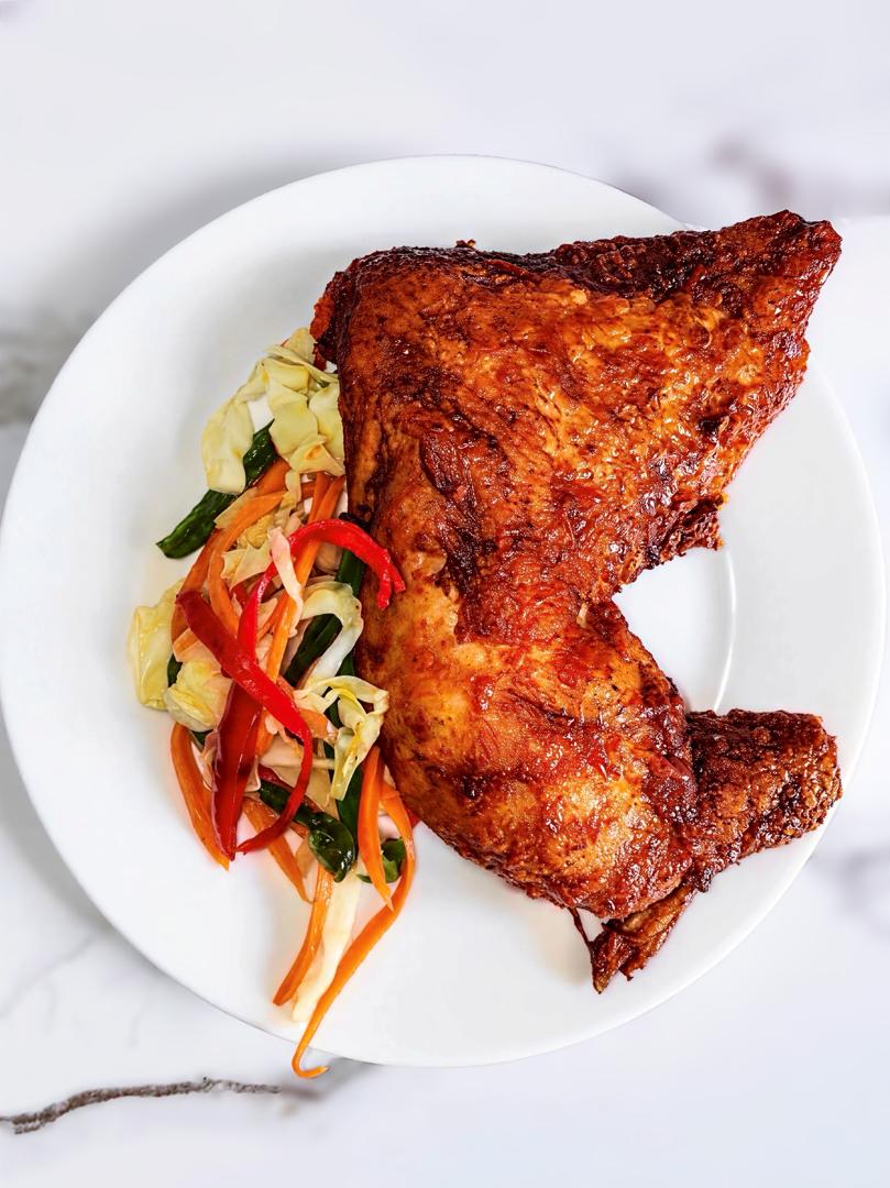 Crispy fried fish served with colourful vegetables